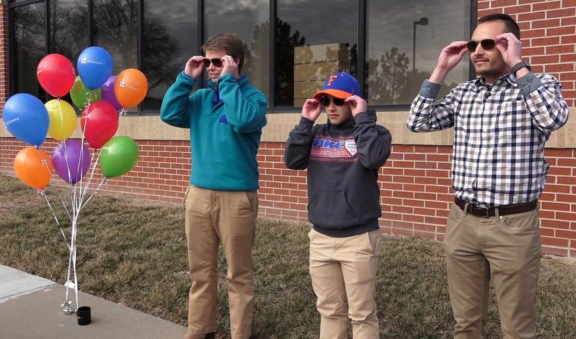 A teen and two men with color blindness in Mission, Kansas, try on special EnChroma glasses. The lenses allow the wearer to experience more color saturation and see better detail and depth. Jill Toyoshiba/Kansas City Star/TNS via Getty Images