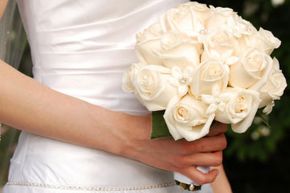 White roses symbolize purity and young love, which makes them a perfect choice for bridal bouquets.