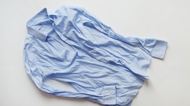 Blue cotton wrinkled and rumpled shirt