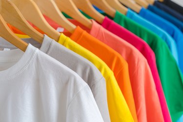 Colorful T-shirts on hangers
