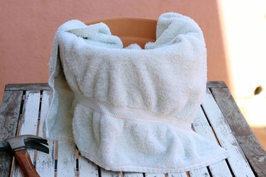 towel around clay pot