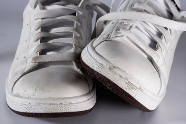 Close-up of dirty white sports shoes