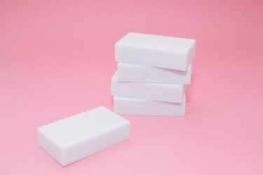 Melamine sponge stack on pink background