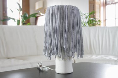 Find a few old t-shirts that have been hanging around your closet and create a whimsical fringe shade.