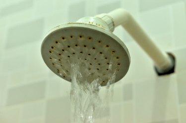 closeup of water falling from showerhead