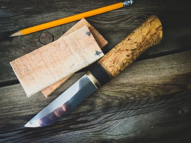pencil and knife with planks