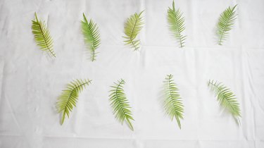 faux green leaves on table