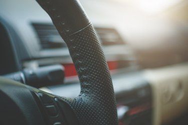Cropped Image Of Steering Wheel In Car