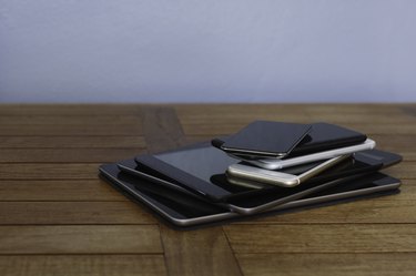 Stack of smart phones and digital tablets