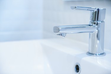 Close-Up Of Faucet In Bathroom