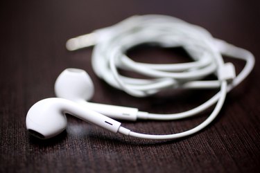 Close-Up Of In-Ear Headphones On Table