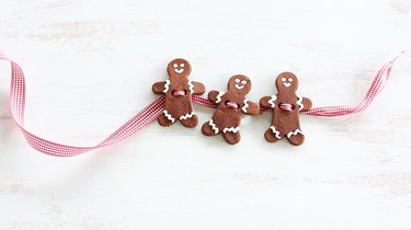 Threading ribbon through gingerbread men