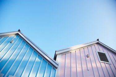 Exterior of warehouse storage sheds in pink and blue
