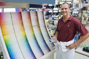 Man in hardware store with paint samples