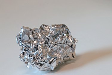 Crumpled heavy duty silver aluminum foil sheet
