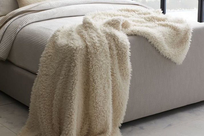 This faux sheepskin throw is an absolute necessity for movie nights.
