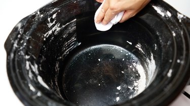 Using DIY gentle cleansing paste for slow cooker inner pot.