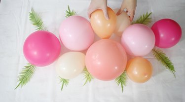 gluing smaller balloon to larger ones
