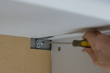 install screw into hollow wall anchor