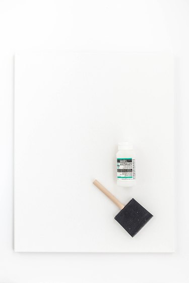 Coat the canvas with a layer of gloss medium and varnish.
