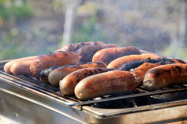 sausages, sausages are grilled, smoke is visible
