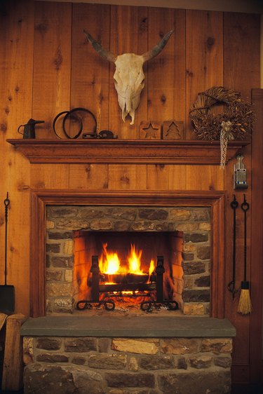 Fireplace and mantle in rustic western lodge