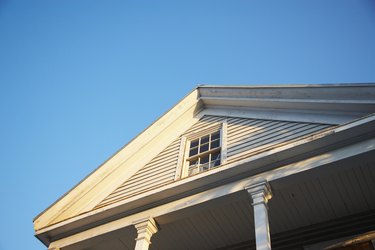 Gable roof over porch with window in pediment