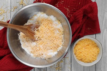 Combine flour, sugar and cheese