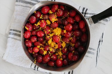 Combine cranberries and orange zest