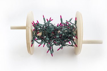 Wrap Christmas lights around a handmade spool