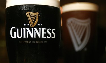 Pints of Guinness beer are pictured in L