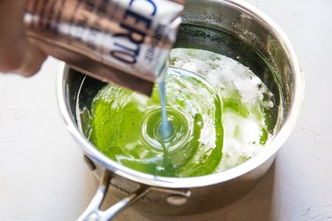 pouring liquid pectin into mint simple syrup