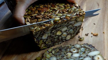 Slicing grain free, paleo-friendly Nordic Stone Age Nut Bread.