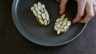 Sticking almonds into frosting