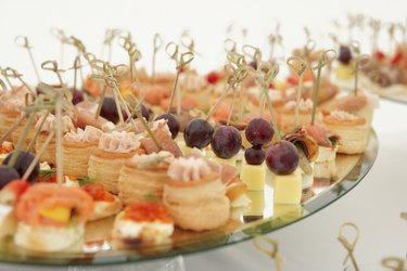 Various snacks in plate on banquet table