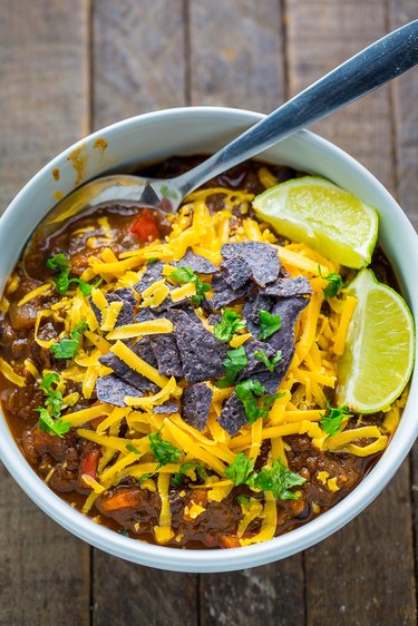 Black Bean and Pumpkin Chili topped with cilantro, tortilla chips and cheddar cheese.