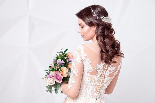 45 Wedding Hairstyles for All Hair Lengths | Whether you’re looking for wedding updo ideas for short, medium length, or for long hair, we’ve curated 45 ideas to inspire you! From a simple half up half down with flowers, to boho styles with braids, to a classic chignon and more, we’ve found DIY styles for every face shape and hair type – straight, wavy, curly, with bangs, thin, thick, and beyond! #weddinghairstyles #weddingupdo #weddinghair